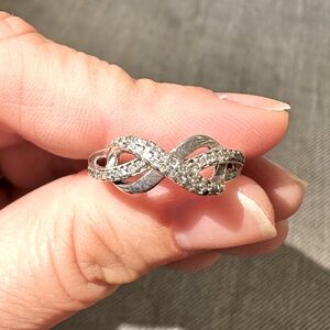 Diamond Infinity Ring 1/10 ct tw Round-
cut Sterling Silver